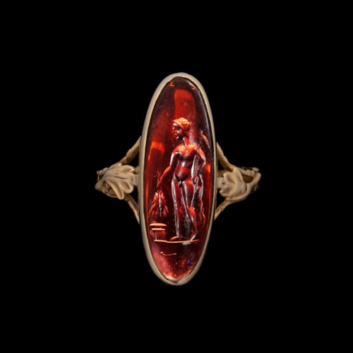 A Late Georgian gold ring set with a Late Hellenistic garnet intaglio. Triptolemus.